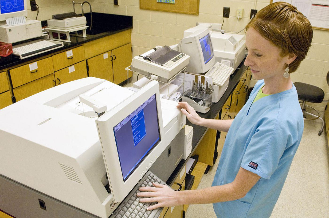 Jessica Walker, a class of 2012 CVM student at Mississippi State University, prepares blood samples at the diagnostic laboratory in Starkville. (Photo by Tom Thompson)