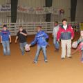 Chickasaw County Emergency Management Agency Director Linda Griffin, second from right, teaches 4-H members how to use found objects to save someone who is drowning during a meeting of the 4-H sportfishing club April 14, 2016, at the Chickasaw County Agricenter. (Photo by MSU Extension Service/Kat Lawrence)