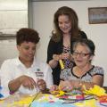Xenia Wickline, center, is a Biloxi community advocate who works with Kim Gowdy, left, to deliver educational sessions to women in the Mujeres Unidas (Women United) program. Rosa Bender has participated in the program for more than a year. (Photo by MSU Extension Service/Kat Lawrence)