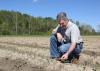 Producers took advantage of a break in the typical spring rains to get much of Mississippi’s corn crop planted in late March. Erick Larson, Mississippi State University Extension Service corn specialist, examined corn in Starkville, Mississippi, on April 5, 2017. (Photo by MSU Extension Service/Kat Lawrence)