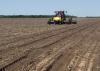 Clear skies have been rare sights as Mississippi farmers started planting their 2016 crops. This soybean planter is establishing a variety trial in a Sunflower County field on May 10, 2016. (MSU Extension Service photo/Greg Flint)