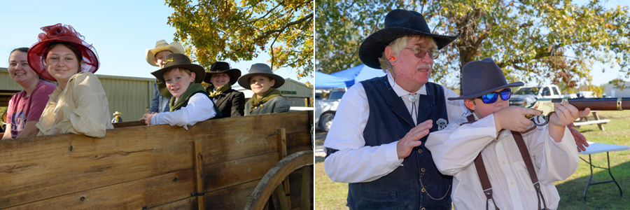 A parent with a group of children, all dressed in Western style clothing; the child who was shown on the far right of the group shooting a gun while a person, also wearing a cowboy hat stands close behind him.
