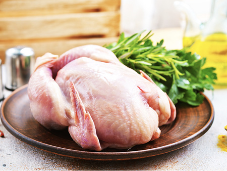 Whole chicken served on a plate.