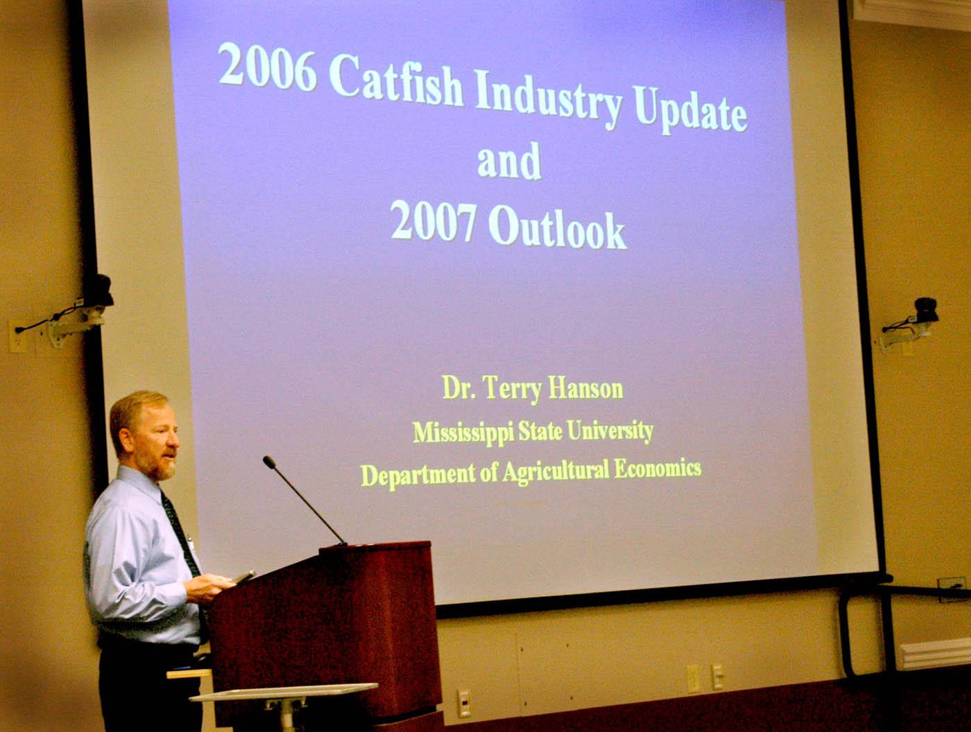 Mississippi State University agricultural economist Terry Hanson speaks at the National Warmwater Aquaculture Center's Fall 2006 catfish seminar held recently at MSU's Delta Research and Extension Center in Stoneville. Hanson told the crowd that rising corn demand will lead to even higher catfish feed prices for farmers in the coming year. (Photo by Robert H. Wells/Delta Research and Extension Center)