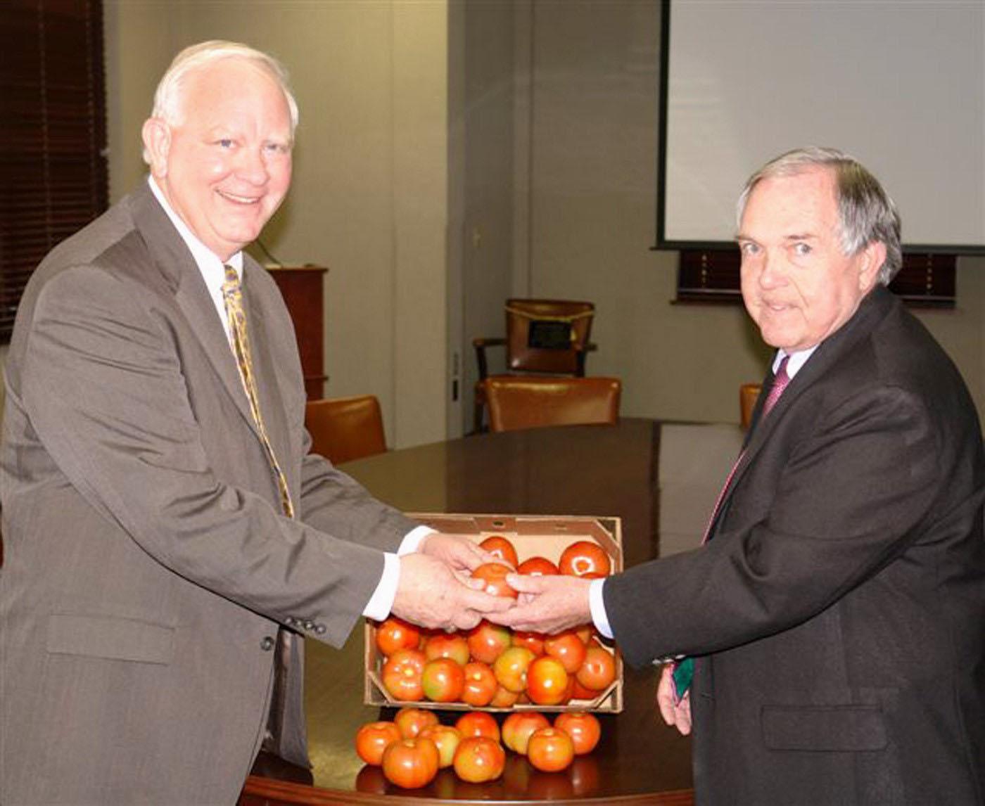 Mississippi Commissioner of Agriculture and Commerce Lester Spell, left, and Vance Watson, Mississippi State University vice president of agriculture, forestry and veterinary medicine, visited the Truck Crops Branch Experiment Station in Crystal Springs during the 17th annual Tomato Producers Short Course on March 5. (Photo by Andy Prosser, Department of Agriculture and Commerce)