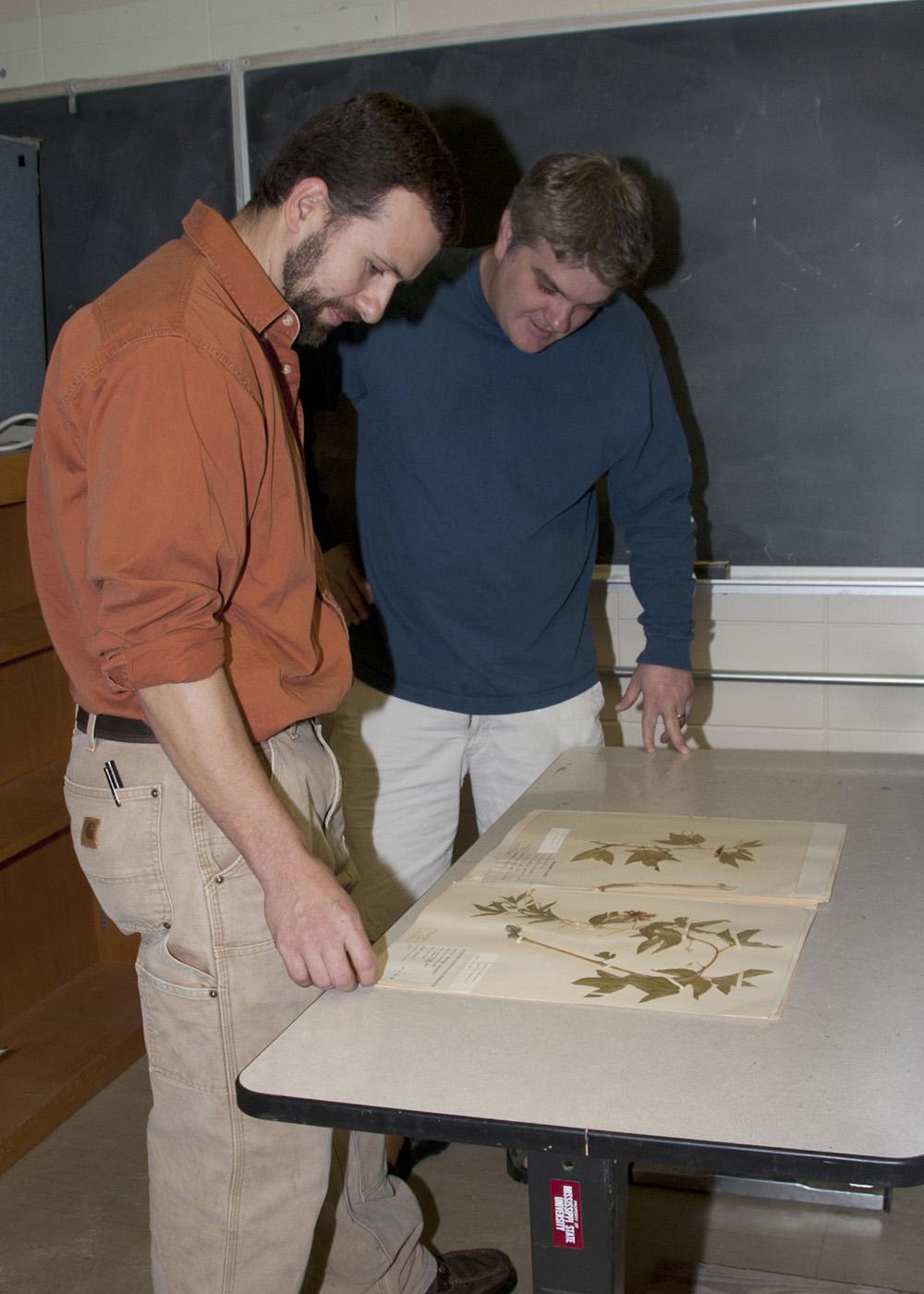 JoVonn Hill, left, and Chris Doffitt helped catalog the plant life in Lauderdale County. They used a variety of sources, including collections at Mississippi State University's Herbarium, to identify the plants they found. (Photo by Kat Lawrence)