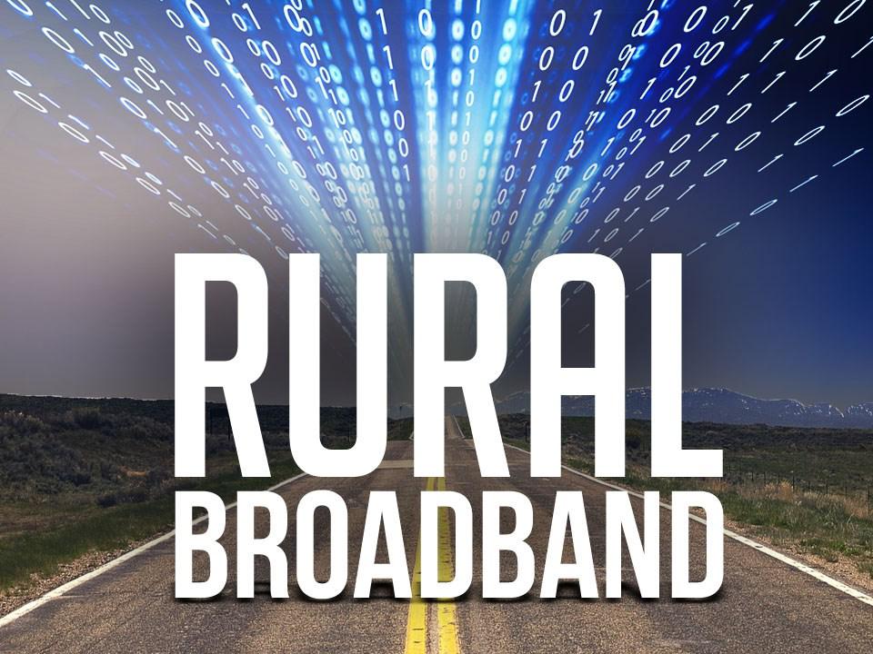 Photo illustration with two-lane highway with computer code and the words "Rural Broadband" superimposed.