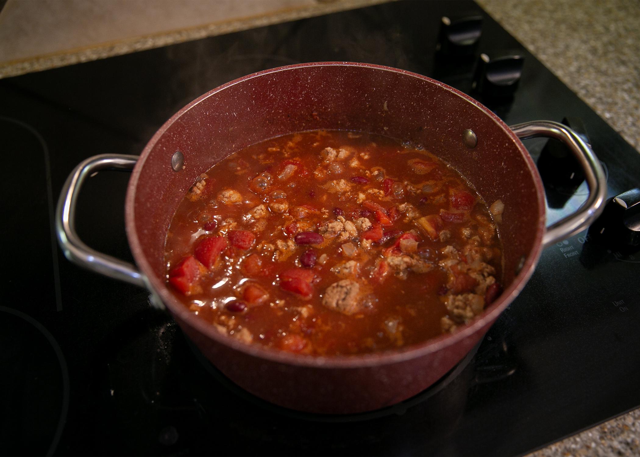 A pot of Quick Chili sits on the stove.