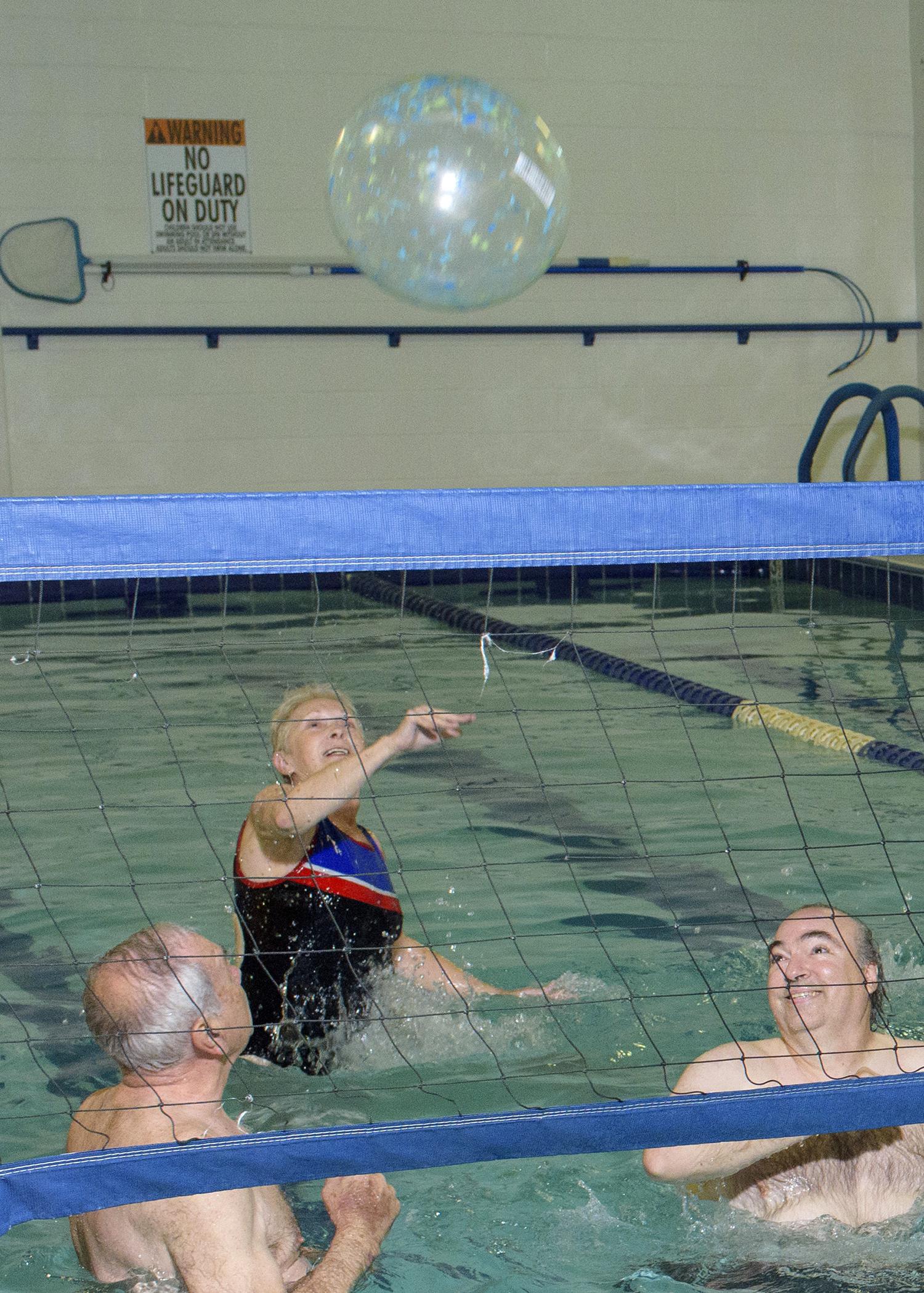 Walking, tai chi, weight-bearing exercises and water workouts, such as water volleyball, will improve strength, balance, coordination and flexibility. (Photo by MSU Ag Communications/Kevin Hudson)