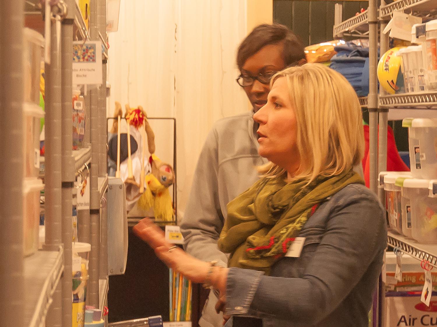 Chrissie Ryals, an Extension associate with the Early Years Network, guides a local resident through resources available at the Central Mississippi Resource and Referral Center in Canton, Mississippi. (MSU Extension Service file photo)