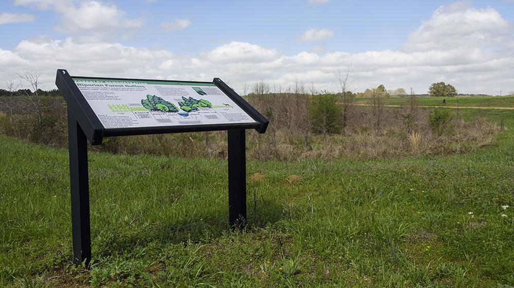 Sign on coastal plain area.