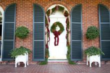 Mississippi State University president Mark Keenum and his family have a pine and magnolia wreath and garland adorning their door this holiday season. The wreath was made by Wm. Puckett, Inc. and the garland is from the Fresh Garland Company. Both items are available for purchase at The University Florist. (Photo by Kat Lawrence)