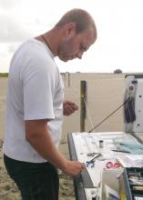 Justyn Foth, a doctoral student at Mississippi State University, prepares to band and measure a western sandpiper in Grand Isle, Louisiana. Foth is a 2014 recipient of the Thomas A. Plein Endowed Graduate Student Scholarship. (Submitted Photo)