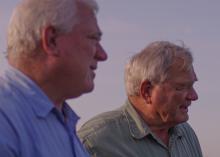 Two men are photographed outdoors.