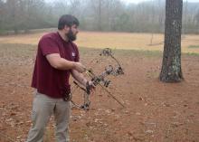 Many archers begin with a compound bow, which uses a system of pulleys and levers to bend the limbs of the bow. (Photo by MSU Extension Service/Linda Breazeale) 