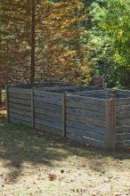 An Ocean Springs Master Gardener developed these three compost bins, which are more elaborate than most home gardeners create. Each bin holds compost at a different stage of decomposition. (Photos by Norman Winter)