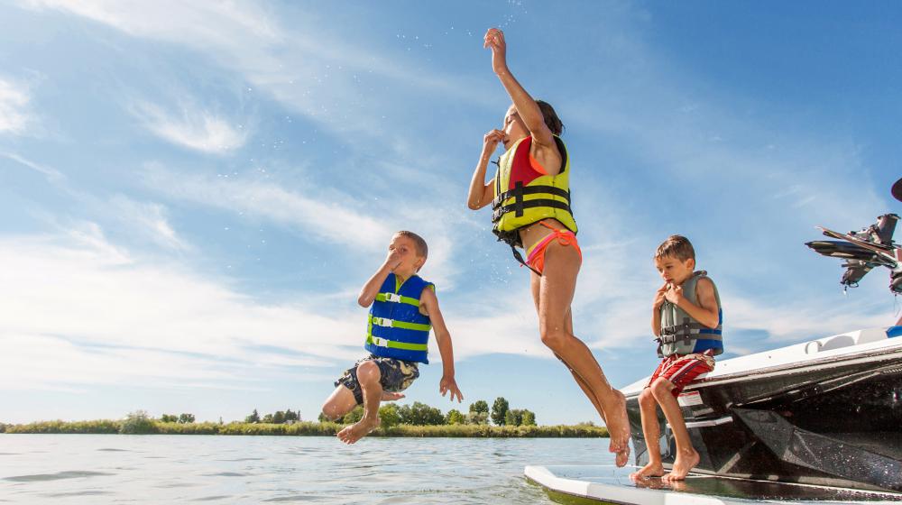 Kids jumping in a lake