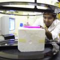 Wasana Siyambalapityage, a master's student at Mississippi State University, positions a tissue culture flask containing breast cancer cells under the resonance generator in the College of Veterinary Medicine. A native of Sri Lanka, she assists researchers in CVM's Department of Basic Sciences in a search to find electromagnetic fields that can reduce the side effects of traditional cancer treatments.