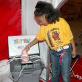 Kelcei Williams, a first grader at Wilkins Elementary School in Jackson, looks at a mouth full of teeth at one of the nine interactive learning stations in the Body Walk exhibit.