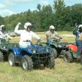 Five members of Mississippi State University's 4-H program staff raise their right hands to signal Clay County youth agent Fran Brock, who serves as the starter. From left are Betty Rawlings, Mary Riley, Landon Summers, Morris Houston and Harvey Gordon, who were test subjects for Brock's certification as a national ATV safety instructor. (Photo by Patti Drapala)