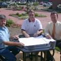 Chickasaw County Extension agent Scott Cagle, left, discusses improvements for Houston Garden Park in the town square with local Master Gardener president John Walden, center, and city mayor Stacey Parker. (Photo by Artis Ford)