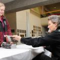 Temple Grandin signs a book Tuesday for Mississippi State University student Kristin Nichols, a member of the College of Veterinary Medicine's class of 2010. (Photo by Tom Thompson)