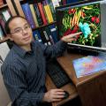 Henry Wan, assistant professor at Mississippi State University's College of Veterinary Medicine, developed a computer program that provides a better understanding of why flu viruses mutate and how they spread. (Photo by Tom Thompson)   