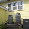 Rain barrels collect water for homeowners to use in their landscapes. The collected water is free and does not have any of the residual chemicals found in tap water. (Photo by Kat Lawrence)