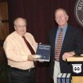 Mississippi State University professor emeritus John Fuquay (right) presents a copy of the first edition the Encyclopedia of Dairy Science and a CD-ROM of the second edition to Terry Kiser, head of MSU's animal and dairy sciences department. Fuquay was recently honored for his work as editor-in-chief of the second edition of the encyclopedia. (Photo by Scott Corey)