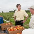 Mississippi State University vice president Greg Bohach, center, gives a listening ear to farming issues important to James Earnest, left, and Doil Moore, owners of Prospect Produce Farm in Chickasaw County. Bohach, MSU vice president for agriculture, forestry and veterinary medicine, visited several farms to hear firsthand reports of how MSU is helping farmers and how the division can help them more in the future. (Photo by Scott Corey)