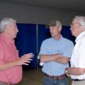 From left, Roger Worsham, a tillage equipment vendor, reviews tillage options with Glenn Gilmer, a farmer from Caledonia, and Normie Buehring, a research professor with the Mississippi Agricultural and Forestry Experiment Station. The three were taking part in the North Mississippi Row Crops Field Day Aug. 9, 2012, at the North Mississippi Research and Extension Center in Verona. (Photo by MSU Ag Communications/Linda Breazeale)