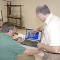 Jim Davis of Olive Branch, left, with the Mississippi Department of Transportation, learns how to use new software from Scott Samson, professor with the Extension Service and the Geosystems Research Institute at Mississippi State University, during a class in Hernando on Oct. 17, 2012. (Photo by MSU Ag Communications/Linda Breazeale)