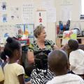 Melissa Tenhet, project director for the Mississippi Child Care Resource and Referral Network shares a story with the preschool students at the Brickfire Project after completing literacy pre-assessments through Starkville Rotary's community service project. (Photo by MSU Extension Service/Alicia Barnes)