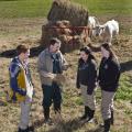 Dr. David Smith talks with Class of 2014 students, from left, Seth Jenkins, Lauren Comstock, and Lauren Bright. Smith says he believes his students learn to think on their feet while working with producers. (Photo by MSU College of Veterinary Medicine/Tom Thompson)