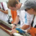 Mississippi State University wildlife biology student Wesley Burger measures a shark caught near Horn Island during a sampling trip for his shark biology class at the Gulf Coast Research Laboratory. Burger became interested in this career through a 4-H wildlife project. (Submitted Photo)