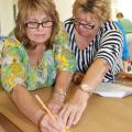 From left, Ramona Edge, Itawamba County Extension coordinator, and Shelaine Pennington, Prentiss County Extension coordinator, learn how to make a flat pattern Aug. 1 during the annual Master Clothing Volunteers conference at Mississippi State University. (Photo by MSU Extension Center for Technology Outreach/Mariah Smith)