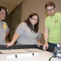 Betsy Padgett, Holmes County Extension agent, and Christina Meriwether, Leflore County Extension agent, learn how to program robots at Mississippi State University's 4-H Robotics Academy on Aug. 13, 2013. (Photo by MSU Ag Communications/Kat Lawrence)