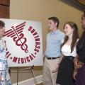 The Rural Medical Scholars program at Mississippi State University is designed to address the state's shortage of medical professionals. From left are Extension Service rural health program leader Bonnie Carew and three of the high school seniors who participated this year: Jason Carter of Horn Lake, Elizabeth Tedford of Clarksdale and Sabrina Micha of Starkville. (Photo by MSU Ag Communications/Kat Lawrence)