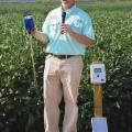 Jason Krutz, an irrigation specialist at the MSU Delta Research and Extension Center, reviews different types of moisture meters available to help farmers determine irrigation timing. Krutz took part in the North Mississippi Research and Extension Center's Agronomic Row Crops Field Day in Verona, Mississippi, on Aug. 7, 2014. (Photo by MSU Ag Communications/Linda Breazeale)