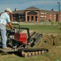 Steve Hughes lays down sod near one of Mississippi State University's new residence halls.  Hughes Sod Installation, of Lee County, placed about 10,000 yards of sod on the campus the week before MSU hosts the first football game of the 2007 season.  (Photo by Linda Breazeale)