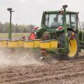 A Mississippi State University worker at the Northeast Mississippi Branch Experiment Station in Verona takes advantage of the ideal weather for corn planting on April 7. (Photo by Scott Corey)