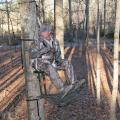 John Louk with the Treestand Manufacturer's Association demonstrates a properly secured safety harness when using a portable, lock-on tree stand. (File photo courtesy of the Treestand Manufacturer's Association)