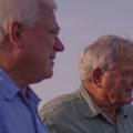 Two men are photographed outdoors.