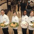 Mississippi State University food science, nutrition and health promotion students Crecencio Deleon of Hattiesburg, Anna Hansen of Long Beach, Keonshae Freeman of Biloxi and Shelly Johnston of Mount Olive serve Edam cheese and Greek yogurt March 6, 2013 at the Institutions of Higher Learning Day at the State Capitol in Jackson. (Photo by MSU Ag Communications/Scott Corey)