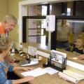 Pontotoc city clerk Dexter Warren and deputy clerk Jamie Sappington assist city residents with utility payments and other city business. The week of May 5 - 11 has been designated Municipal Clerks Week to recognize the service of clerks and their deputies to communities. (Photo by MSU Extension Service Center for Government and Community Development/Bob Ratliff)