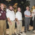 Regions Bank representatives, from left, Brad Jones, Walt Stephens and Alan Sims join Mississippi State University forest products professor Phillip Steele as he accepts the Superior Faculty Award for research from Greg Bohach, vice president for the Division of Agriculture, Forestry and Veterinary Medicine on Aug. 2. Regions Bank pledged $50,000 over five years to fund DAFVM awards for exceptional merit in five areas: teaching, research, Extension and outreach, service, and international collaboration. (Ph