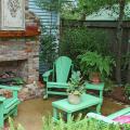 This outdoor fireplace with Adirondack-style chairs, matching coffee table, end table and loveseat creates a room that is soothing and inviting on our cooler days. (Photo by Norman Winter)