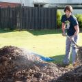 Ted Benge, a landscape architecture student from Nashville, turns a steaming compost pile at Mississippi State University as part of a project begun last spring. (Photo by MSU Ag Communications/Kat Lawrence)