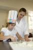 Camper Kendall Willeford of Starkville and Kristin Weaver of Byhalia, a student in the Food Science, Nutrition and Health Promotion program at Mississippi State University, prepare the ingredients for a dish during Fun with Food. (Photo by MSU Ag Communications/Kat Lawrence)