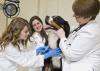 Chelsea McIntosh takes a blood sample from a patient with assistance from Sandra Bulla and Dr. Kari Lunsford. Scientists at Mississippi State University's College of Veterinary Medicine are studying the role of platelets in diagnosing canine cancer. (Photo by MSU College of Veterinary Medicine/Tom Thompson)